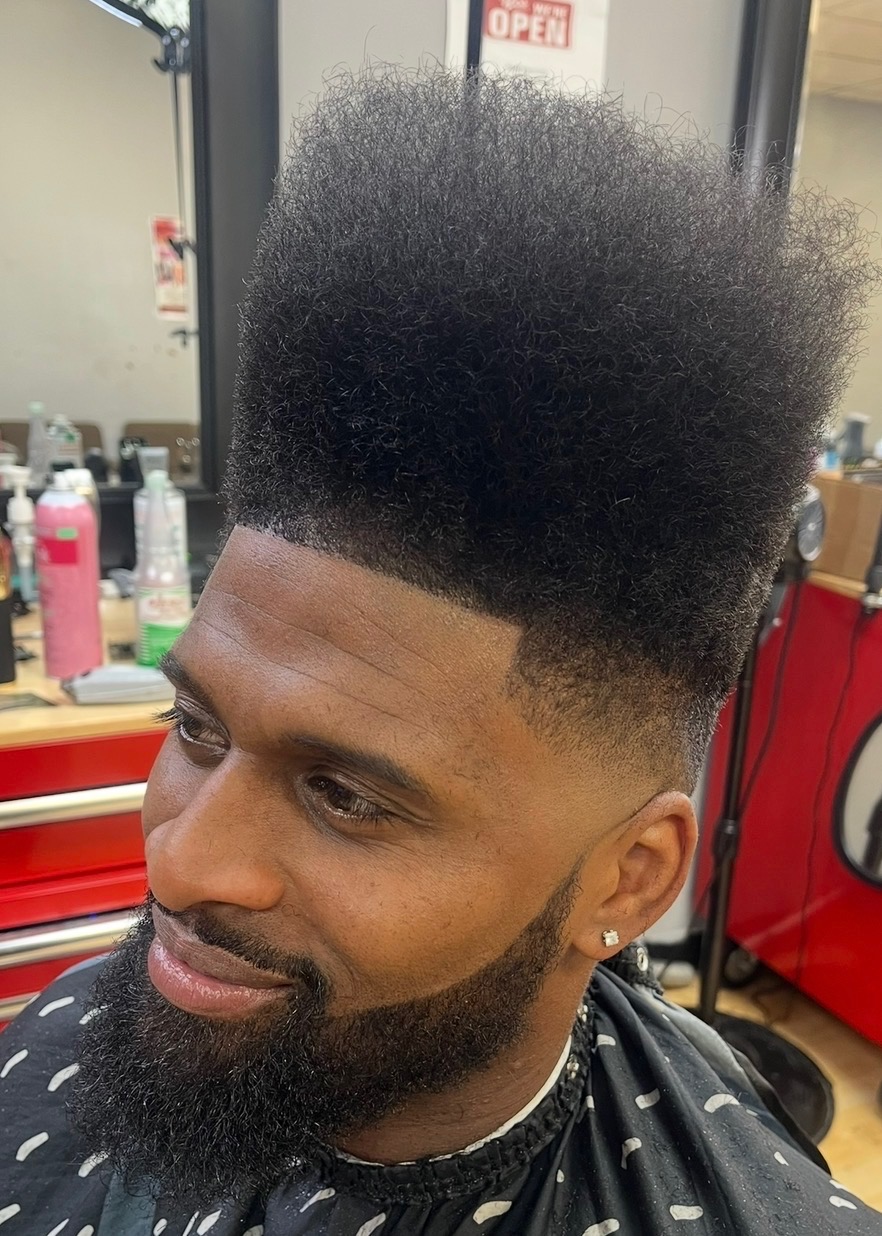 Client after a squared-off flat top with a sharp lineup and fade