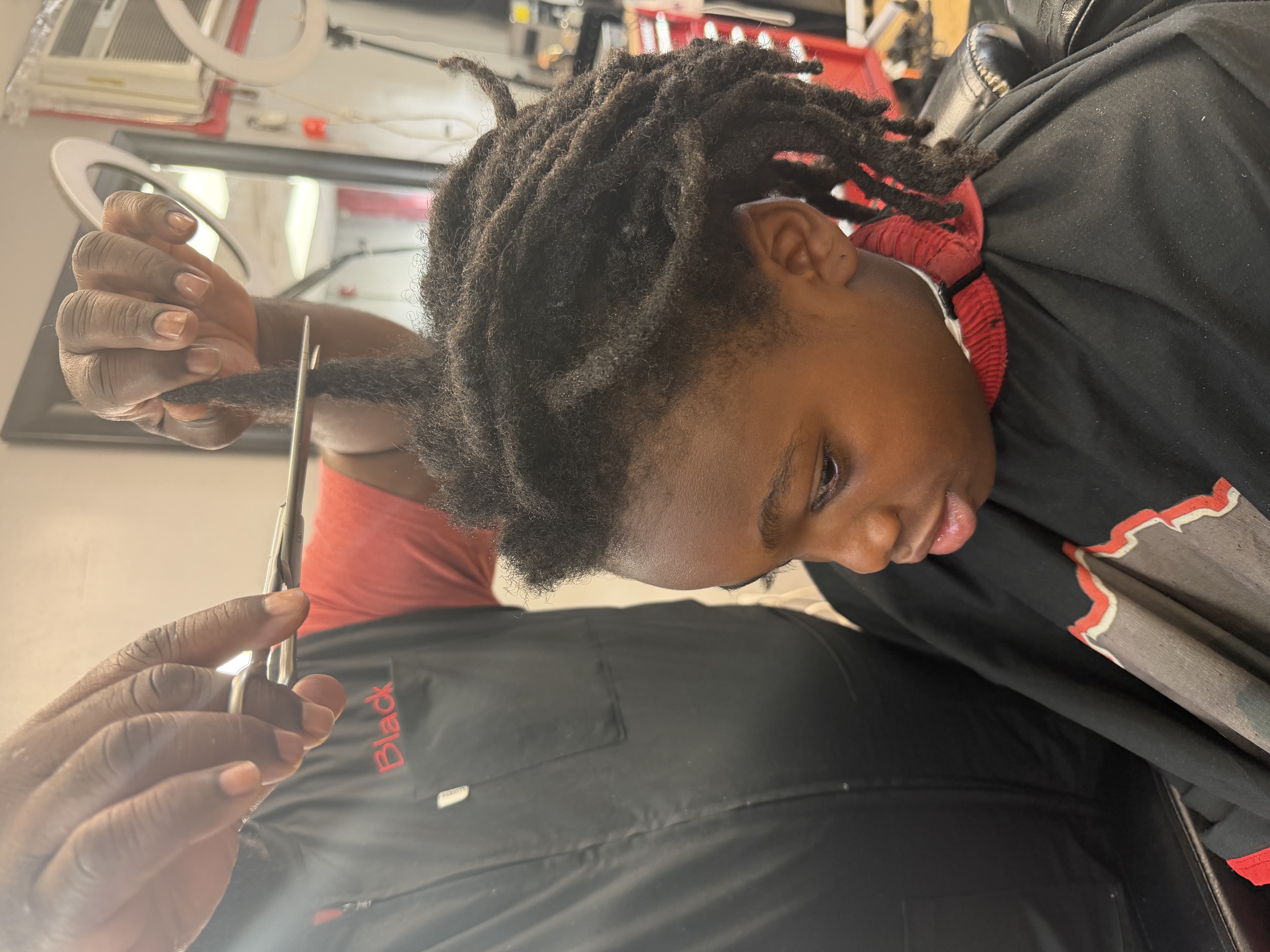 The same client before, with shoulder-length locs