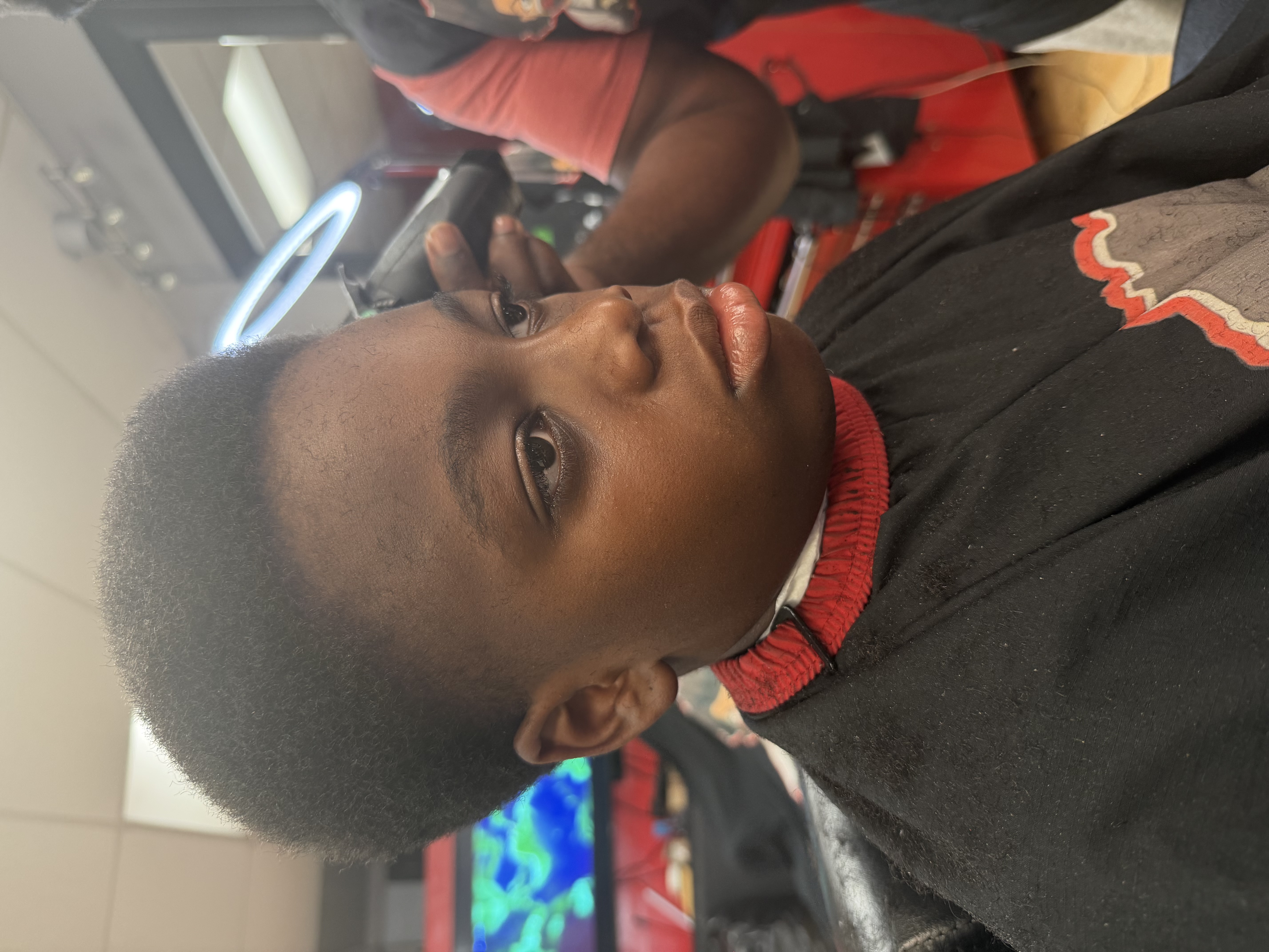 The same client before the shape up, mid-cut in the chair